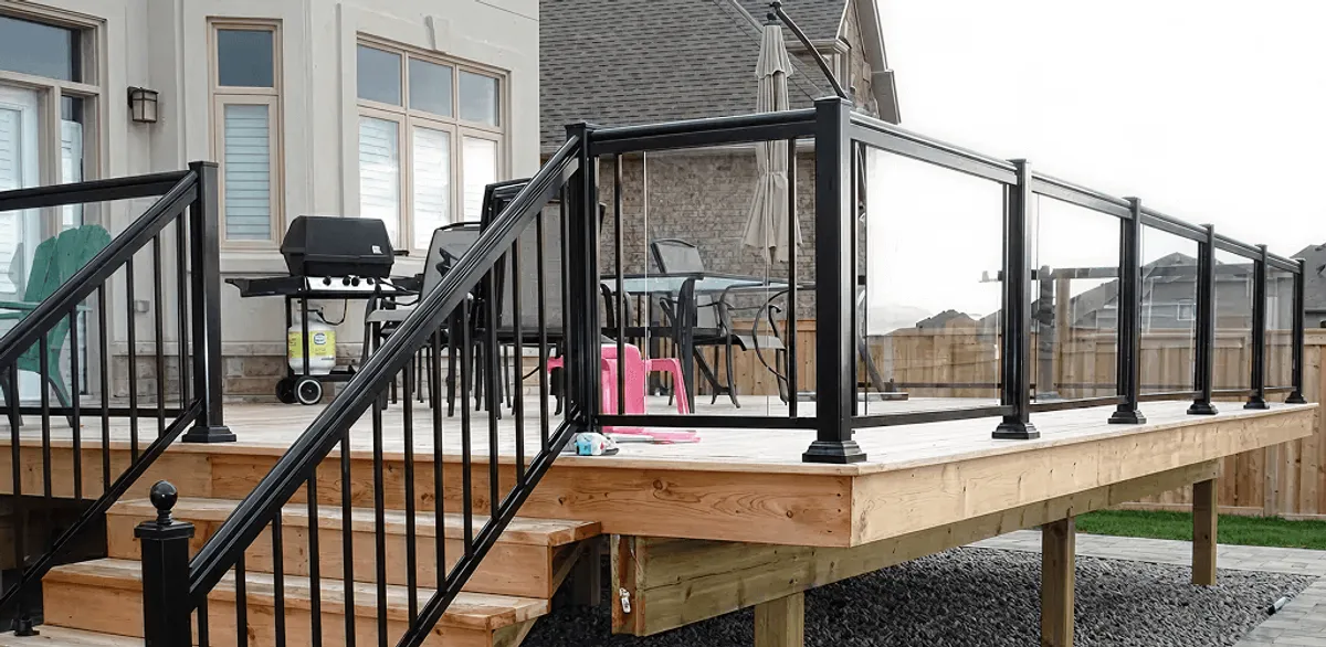 Handrail installation on a deck staircase for safety and code compliance in Colorado Springs, CO
